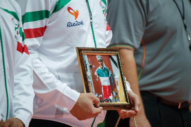 One of the IRI team holds a portrait of Para cyclist Bahman Golbarnezhad IRI  who sadly died whilst competing the previous day. Men's Gold Medal Match, Match 18 Bosnia and Herzegovina vs IR Iran. Sitting Volleyball at the Riocentro - Pavilion 6. The Paralympic Games, Rio de Janeiro, Brazil , Sunday 18th September 2016. Photo: Simon Bruty for OIS/IOC.  Handout image supplied by OIS/IOC