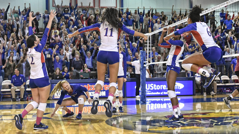 Kansas volleyball fans cheering at Allen Fieldhouse